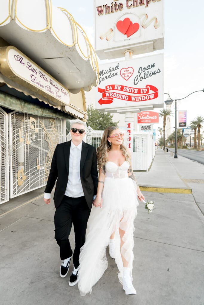 couple at little white wedding chapel