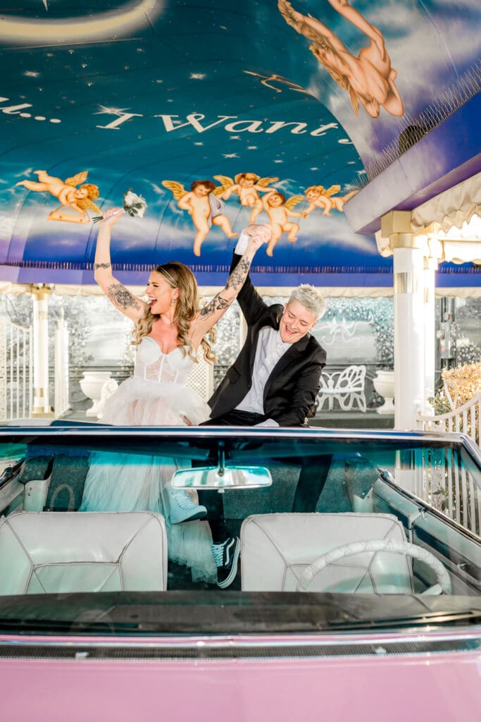 couple celebrating their union at little white wedding chapel