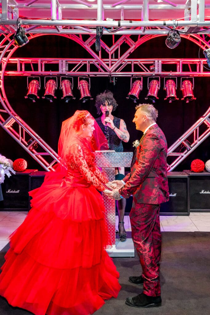 bride and groom holding hands at their eclectic ceremony