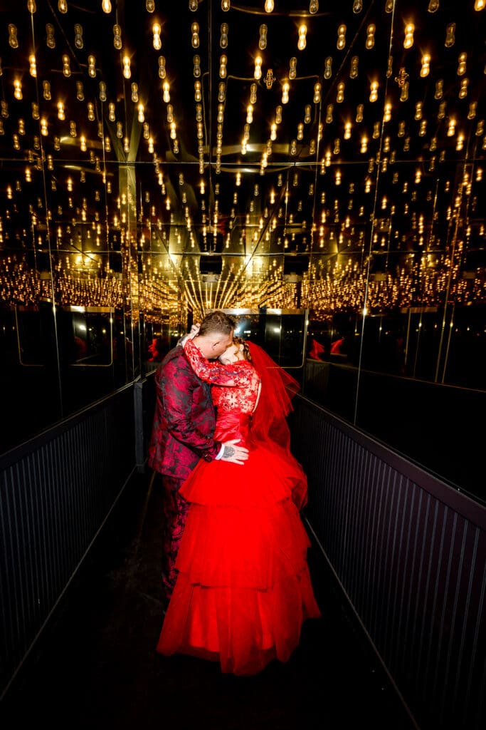 groom kissing the bride on the cheek 