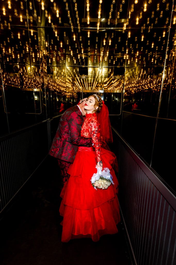 groom kissing the bride on the neck