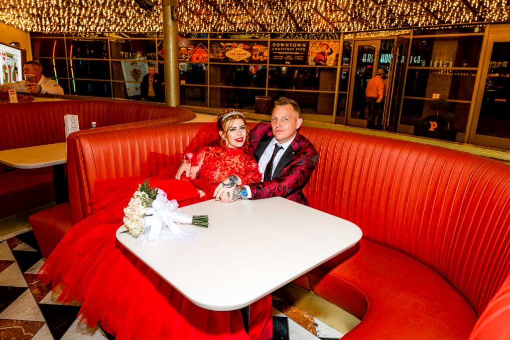 cute couple celebrating their las vegas micro wedding with drinks