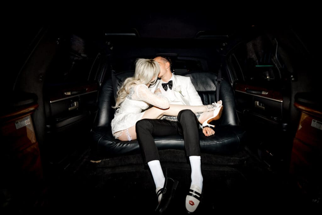 portrait of the bride and groom kissing after their ceremony