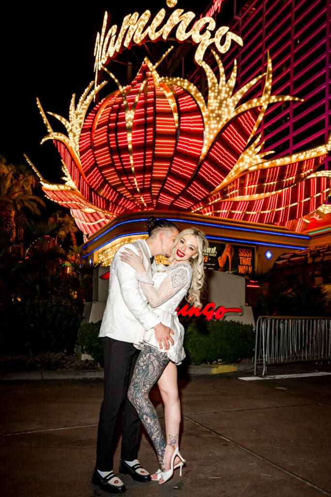 groom kissing the bride on the cheek during their bridal session