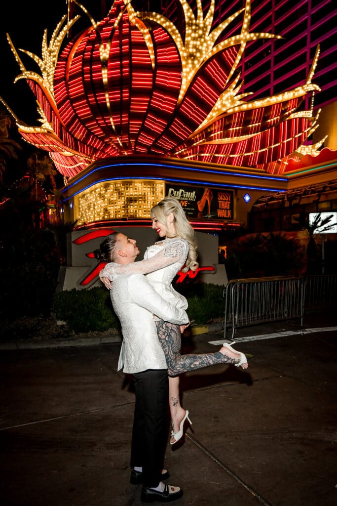 fun portrait of the newlyweds at their eclectic and iconic las vegas elopement