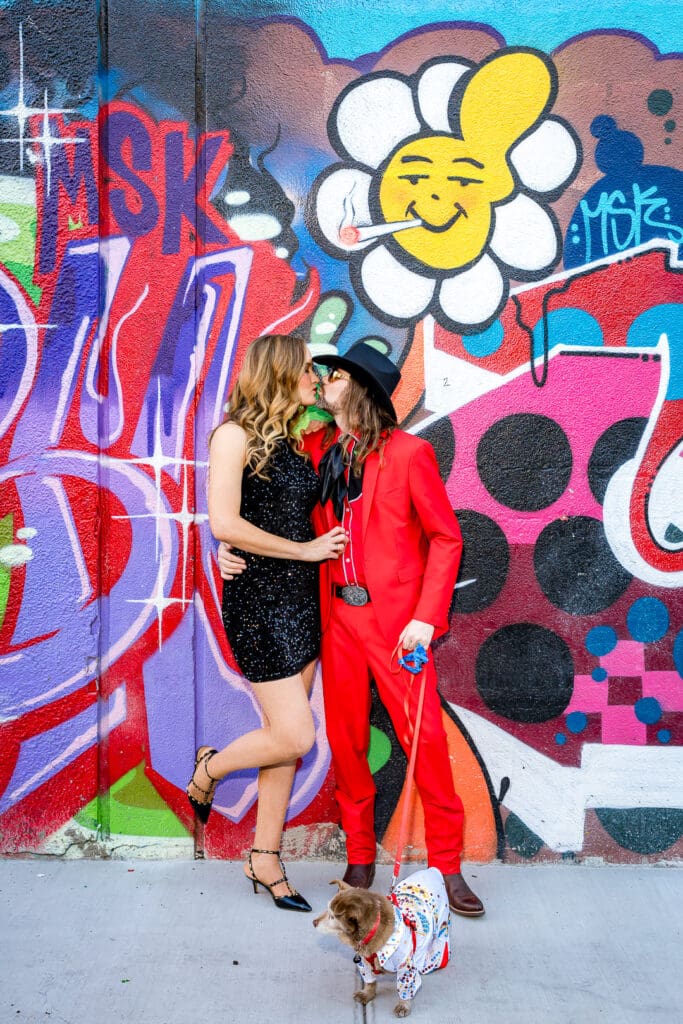 picture of the couple kissing during their photoshoot in fremont street
