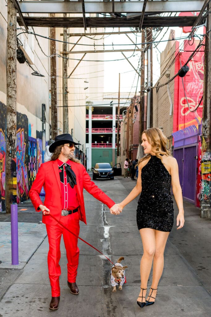 couple holding hands laughing with each other during their photoshoot