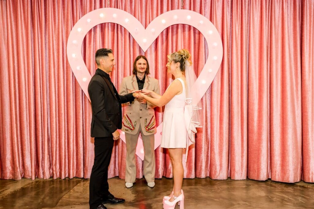 couple holding hands during their vow renewal
