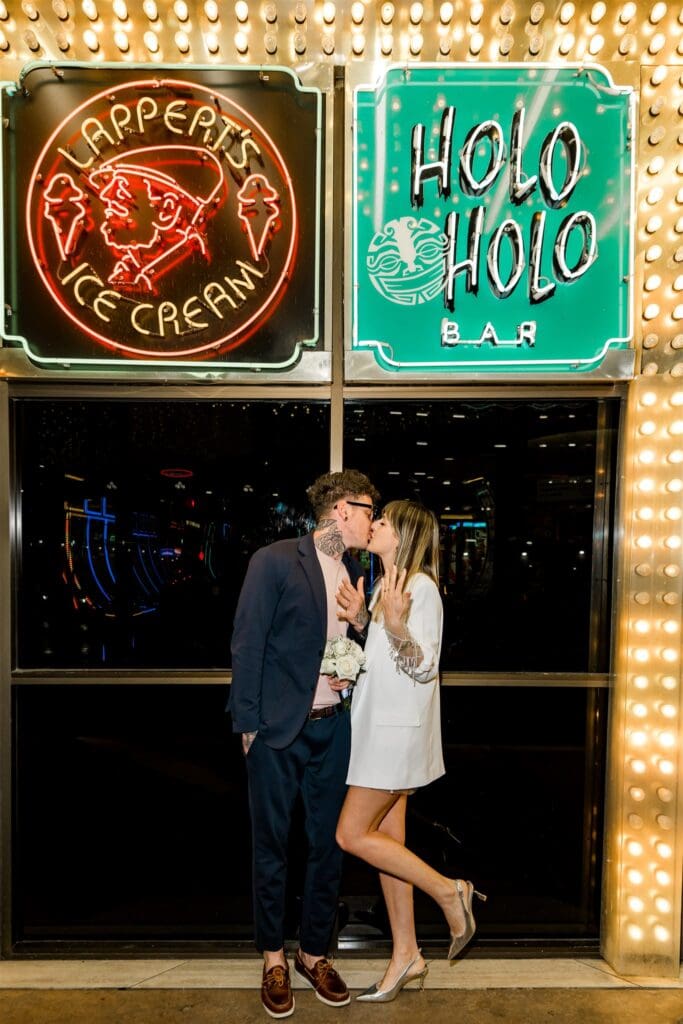 picture of the newlyweds showing their elopement rings