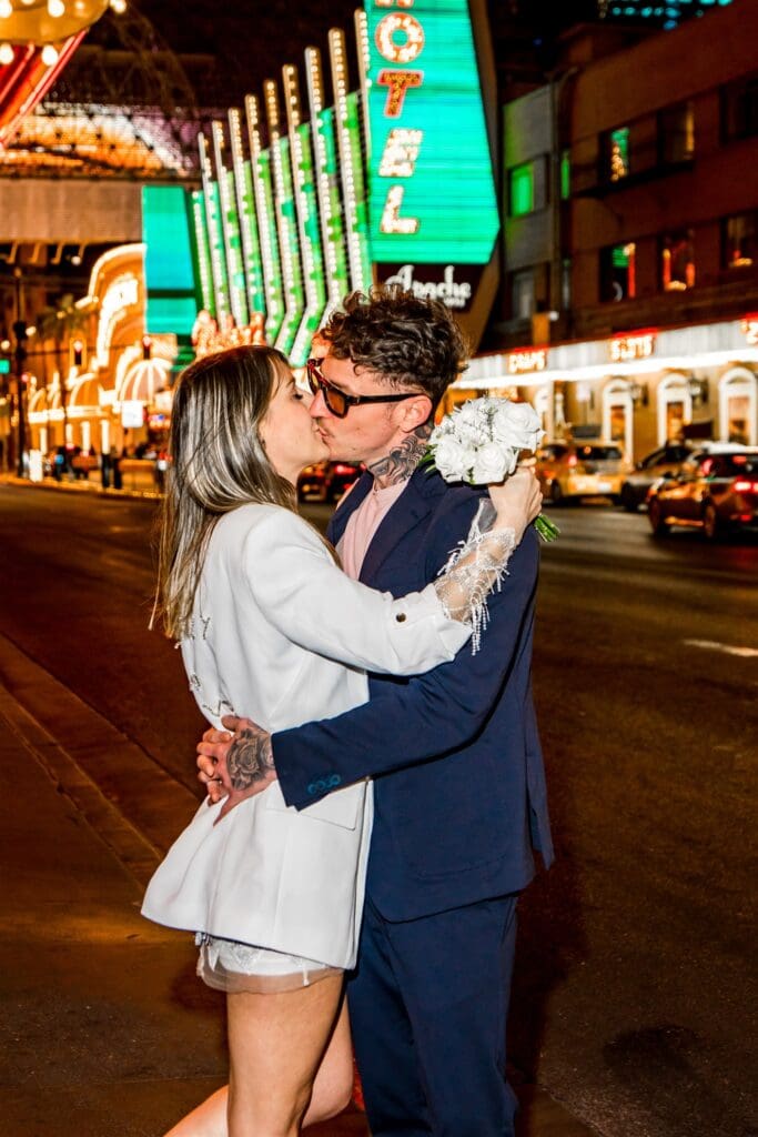 happy couple walking around fremont street