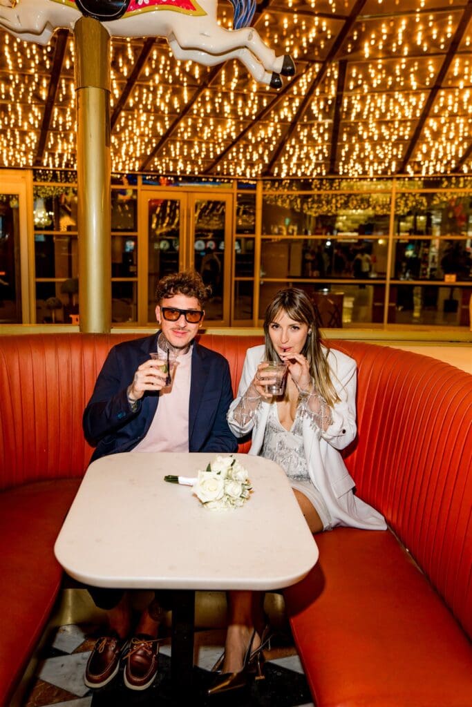 cute couple having a drink after their elopement