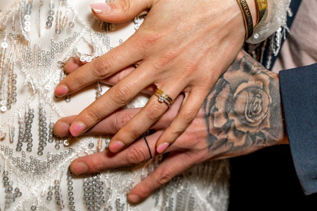cute couple showing their elopement rings