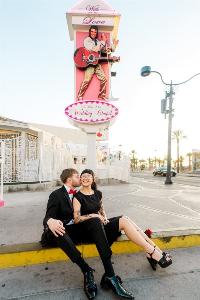 picture of the groom kissing the bride on the cheek