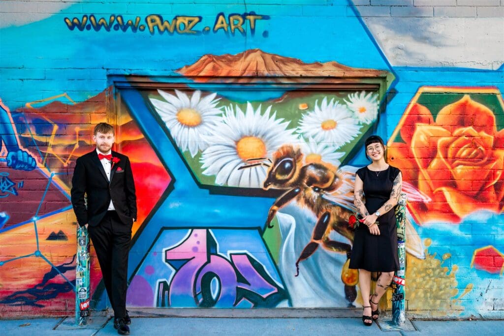 cute couple at a mural during their phtooshoot