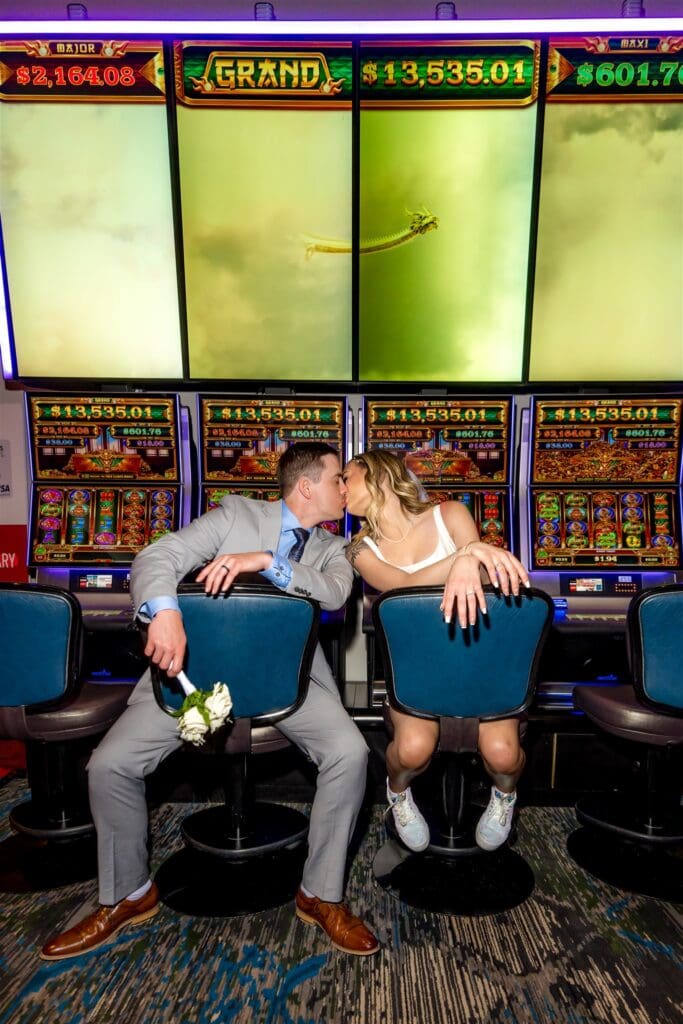 couple kissing during their photoshoot at the casino