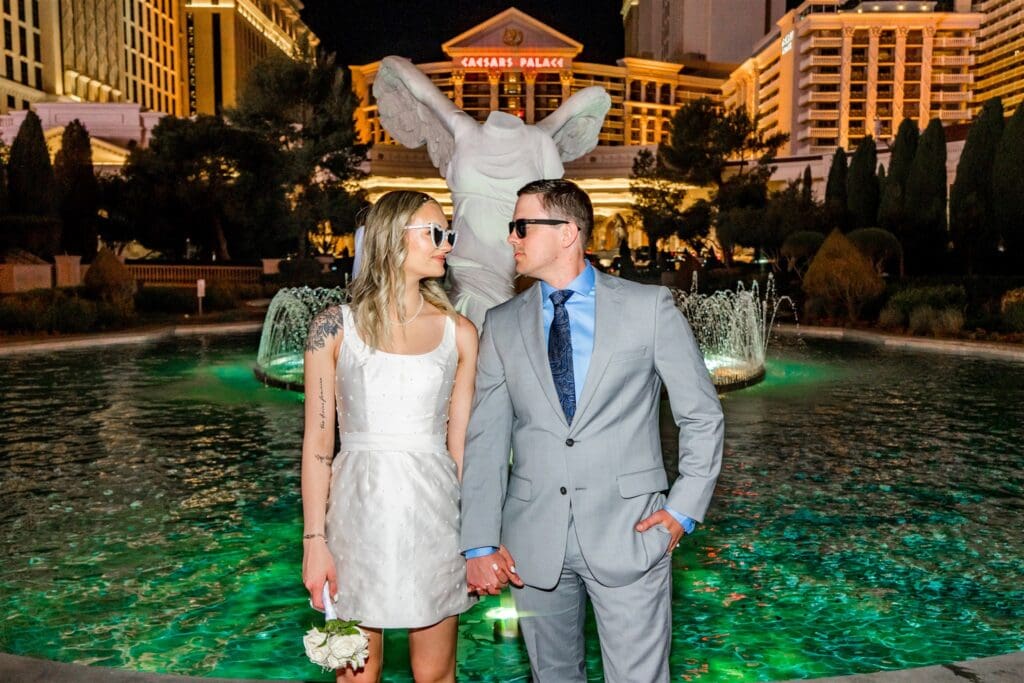 couple at a fountain during their photoshoot
