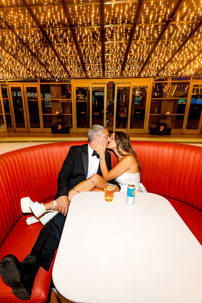 picture of the bride and groom kissing at their favorite bar