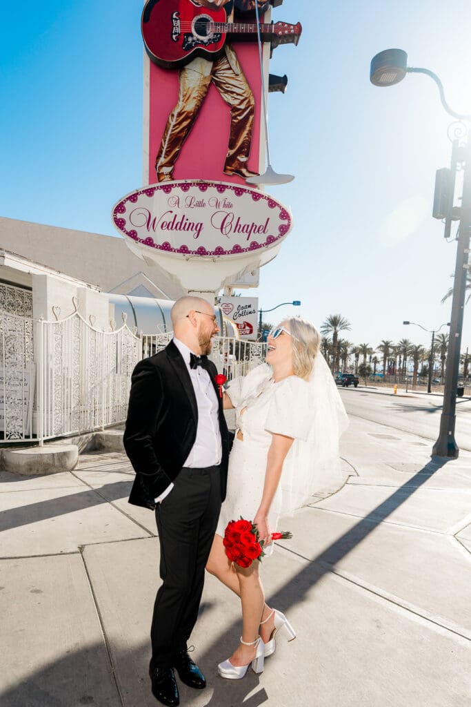 cute portrait of the newlyweds laughing at each other