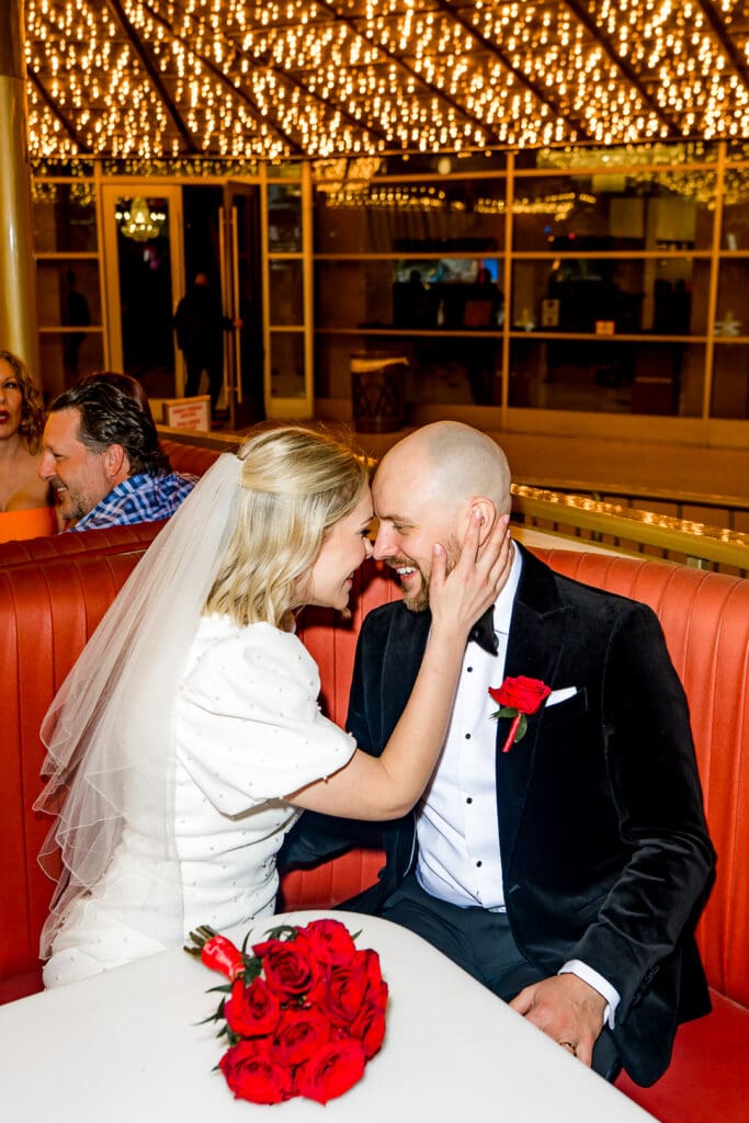 happy newlyweds celebrating their elopement at a bar