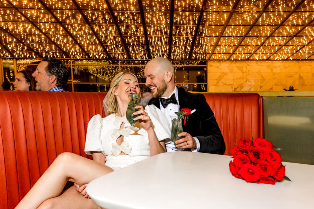 cute couple celebrating their elopement with drinks