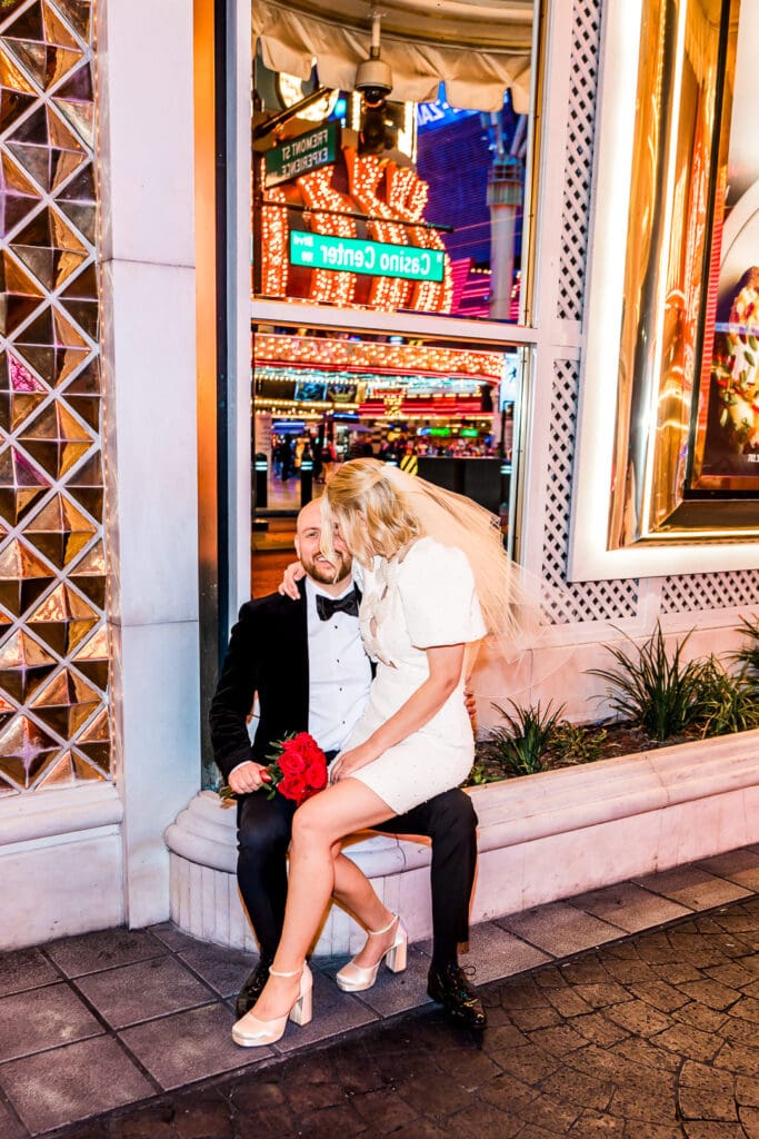 bride kissing the groom on the forehead