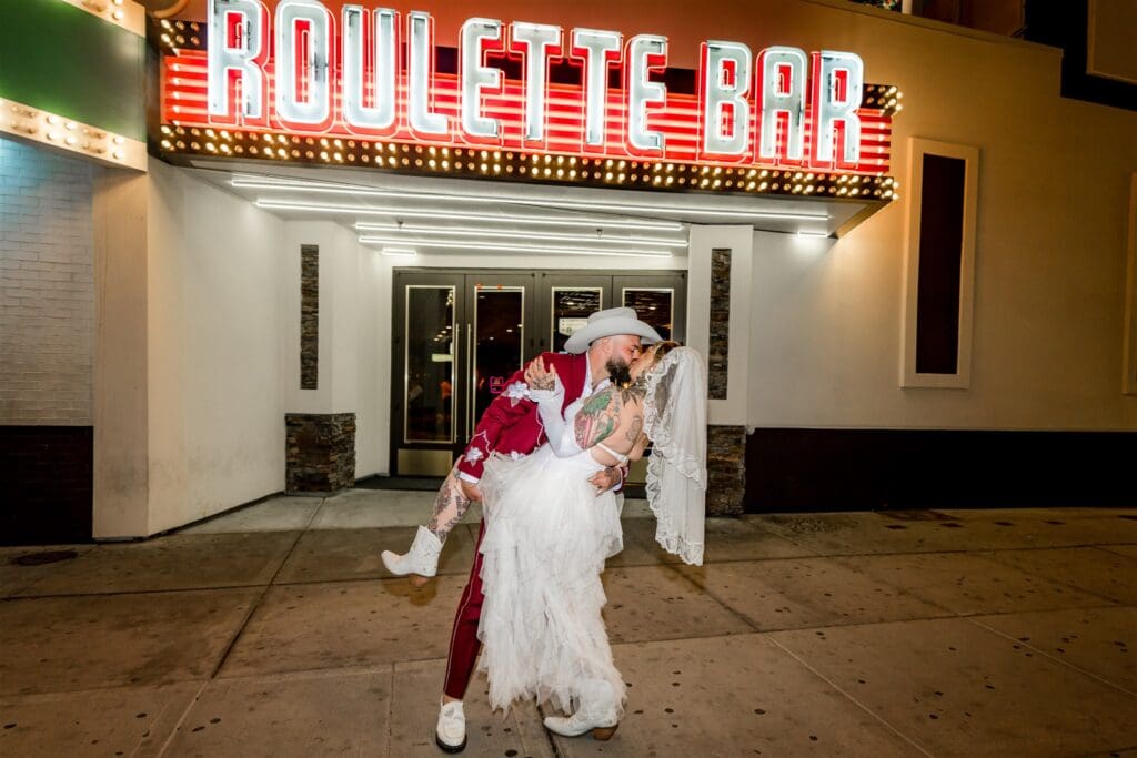 portrait of the newlyweds kissing
