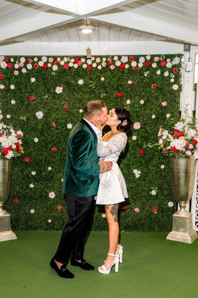 newly married couple kissing after their ceremony