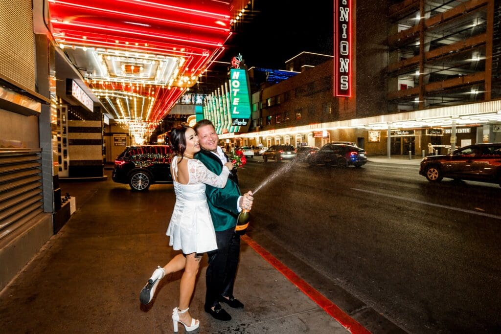 couple celebrating their elopement with champagne 