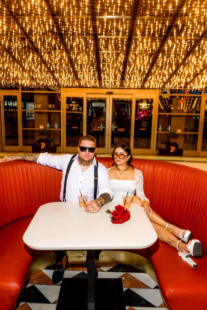 cute couple celebrating their elopement with a drink