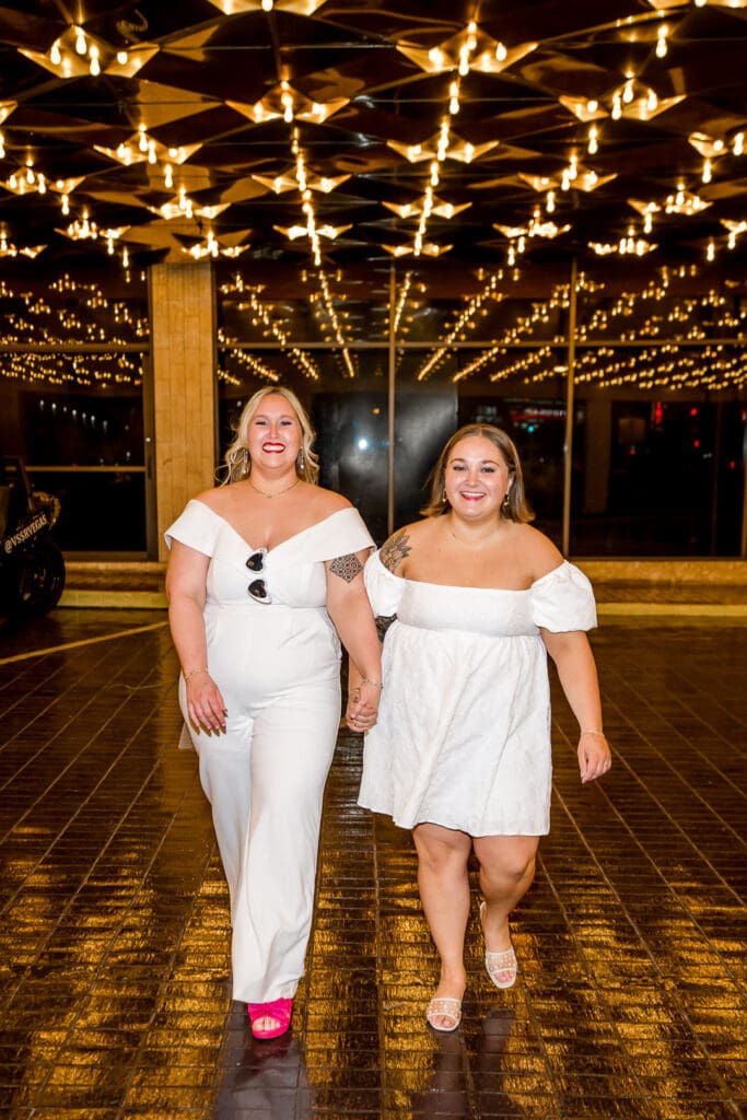 couple walking around fremont st during their elopement  