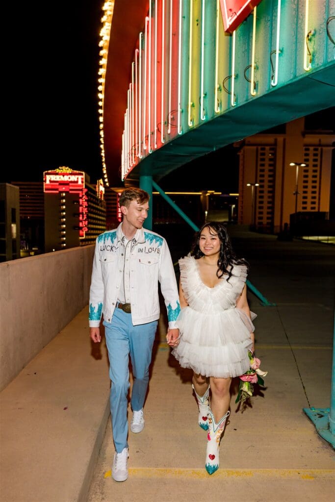 couple walking around fremont st 
