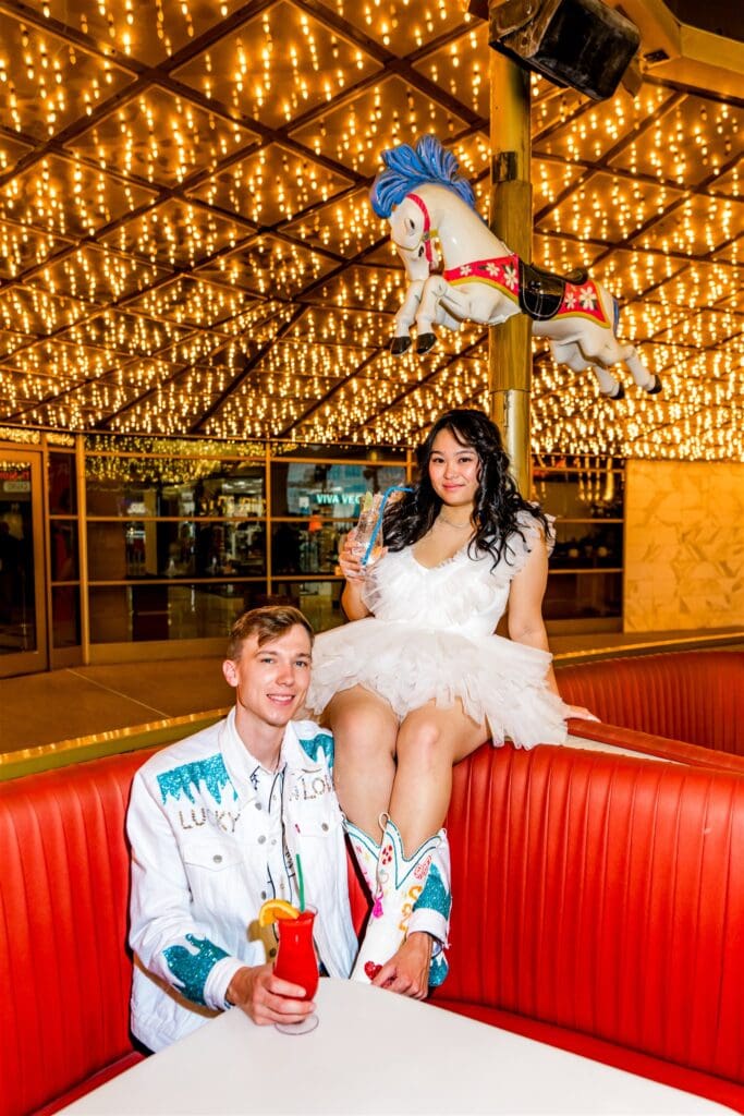 couple celebrating their elopement with a drink