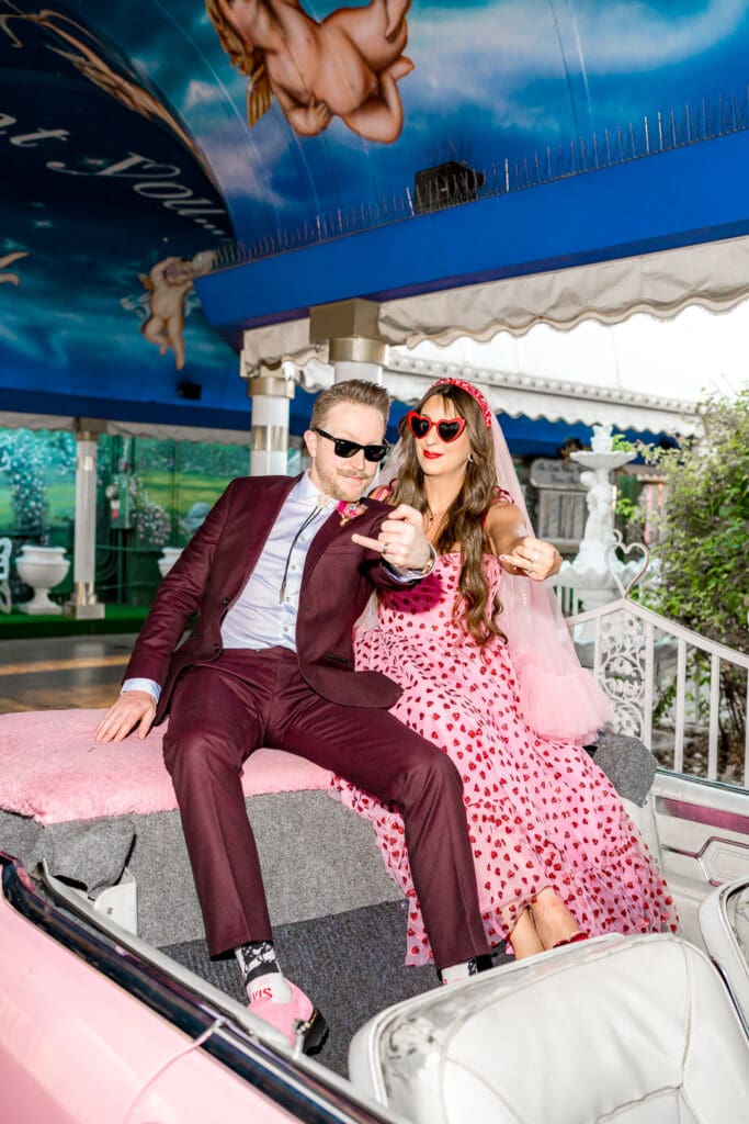 fun picture of the couple showing their wedding rings