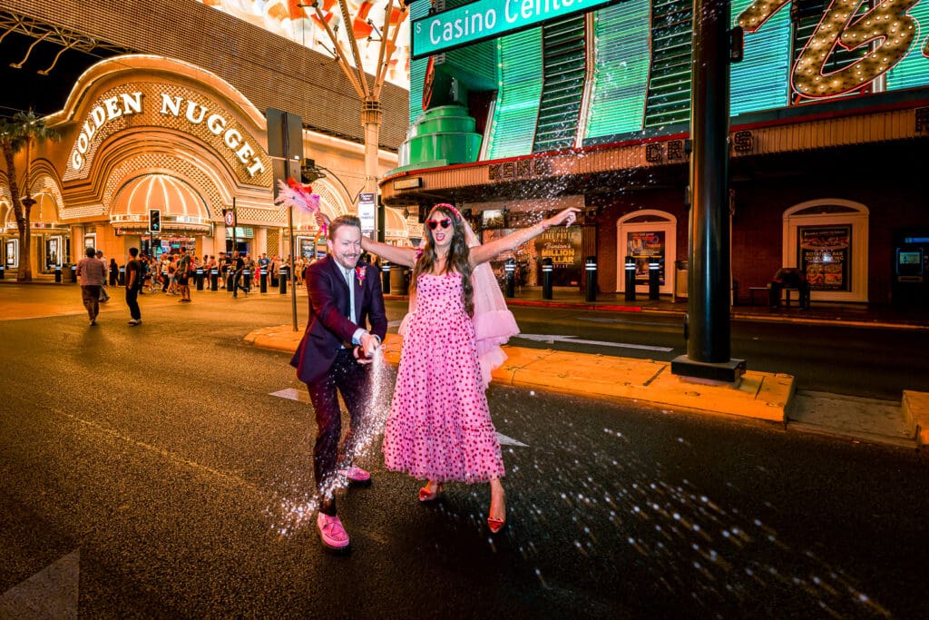 couple celebrating their vows with champagne