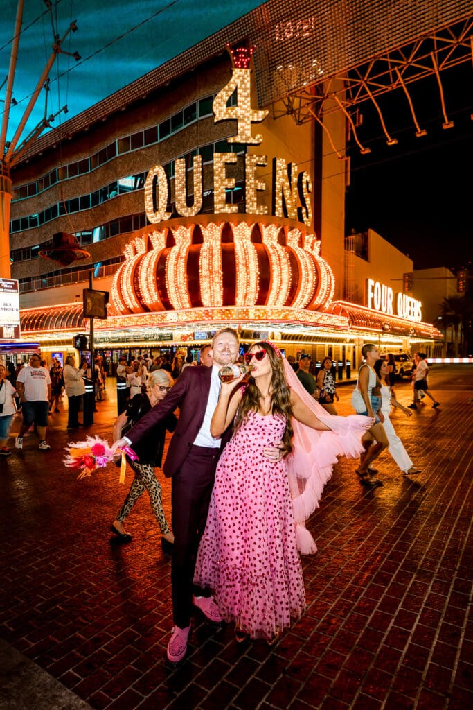 couple in downtown fremont st during their photoshoot
