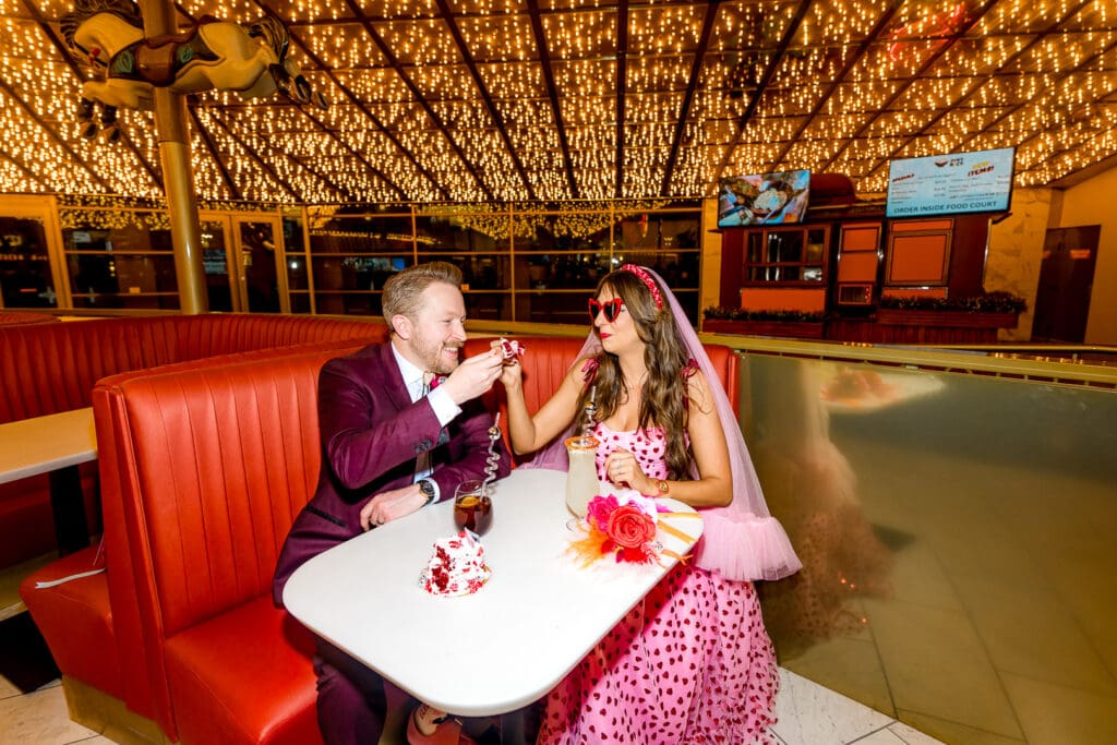 couple celebrating after their ceremony with drinks 