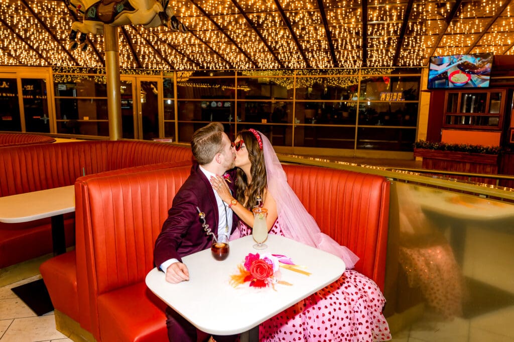 cute picture of the couple kissing during their photoshoot in sin city