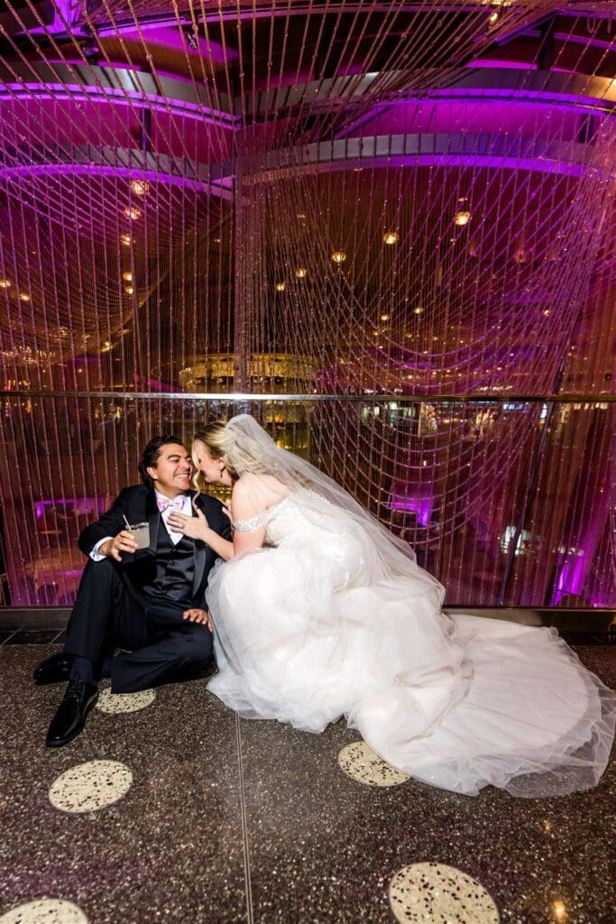 bride and groom laughing with each other during their photoshoot