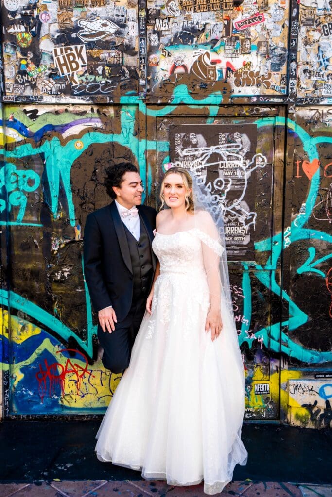 couple smiling at the camera during their bridal photos