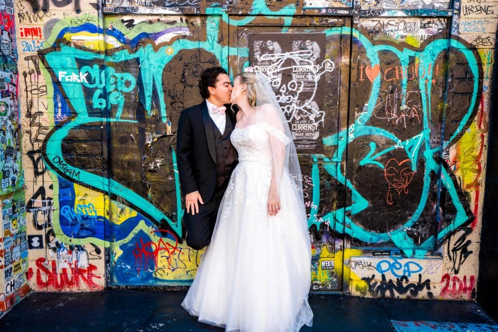 portrait of the bride and groom kissing