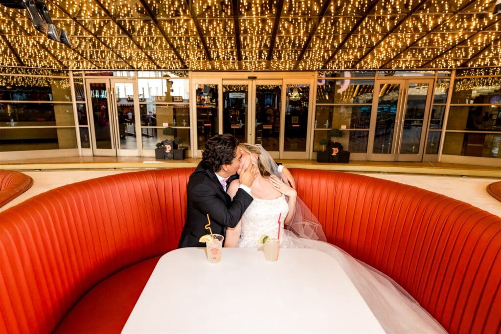 portrait of the newly eloped couple kissing