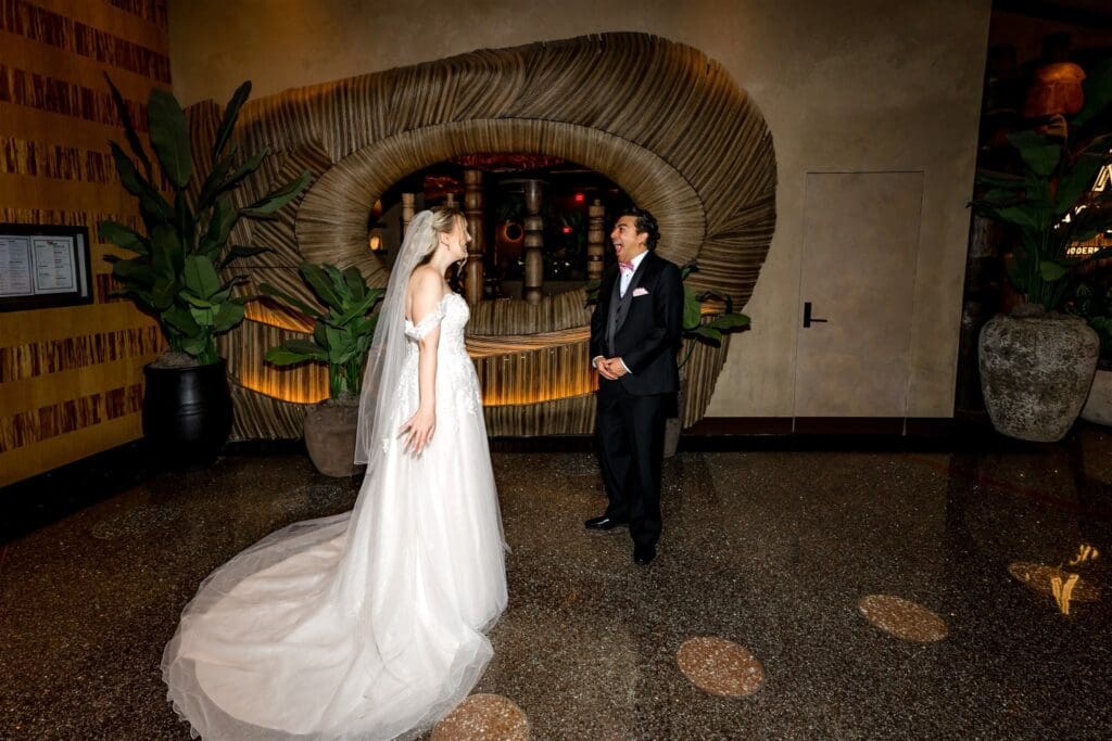 groom emotional seeing the bride in her wedding dress