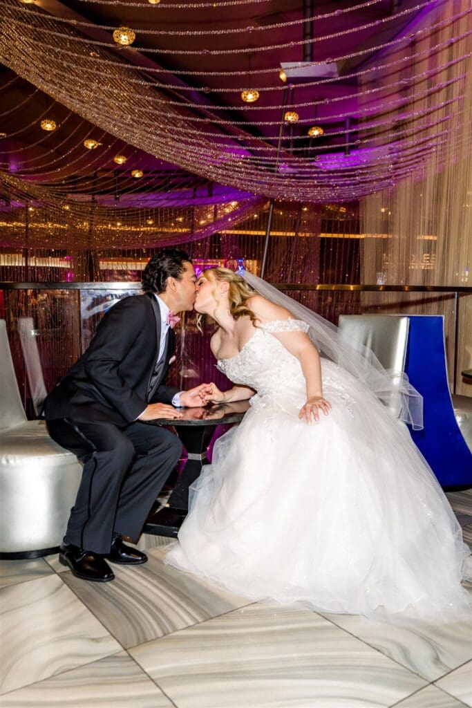 cute picture of the bride and groom kissing during their photoshoot