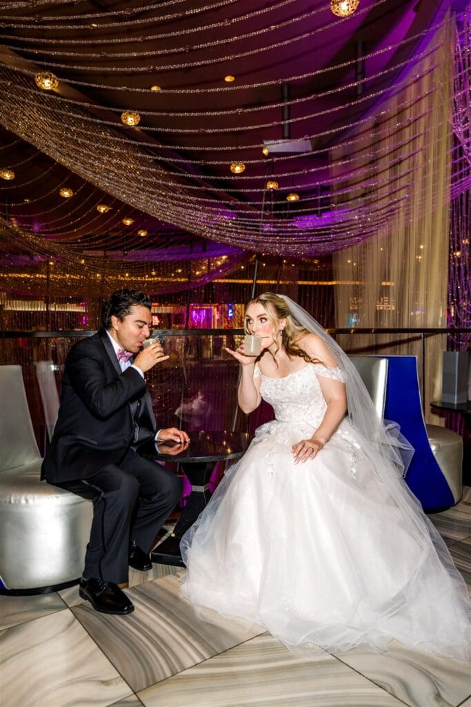 couple celebrating their elopement with champagne
