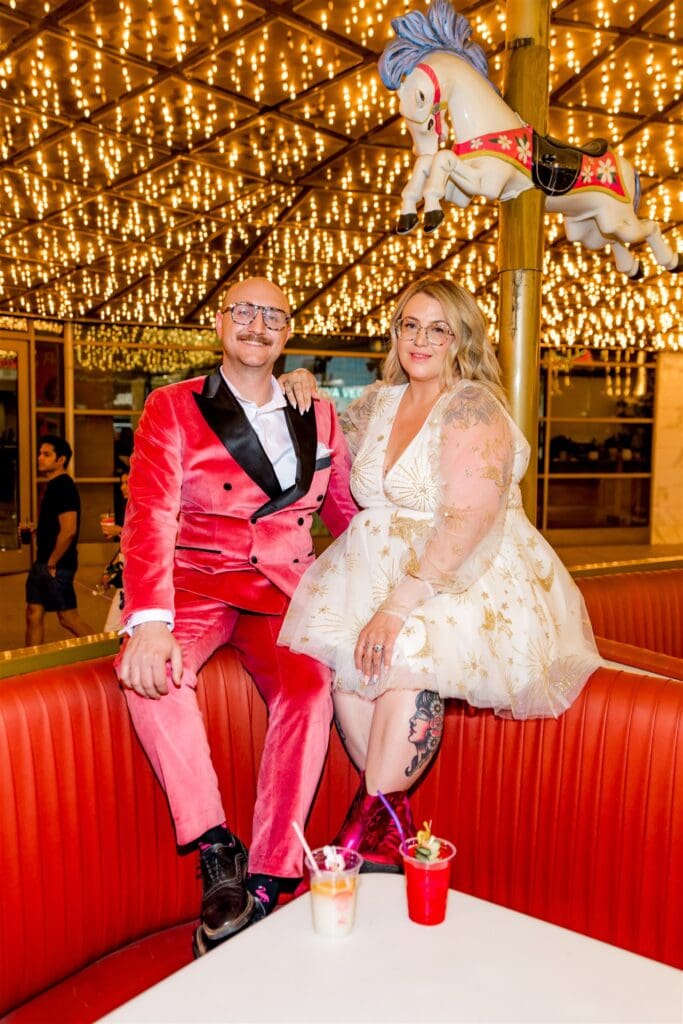 couple celebrating their elopement with a drink