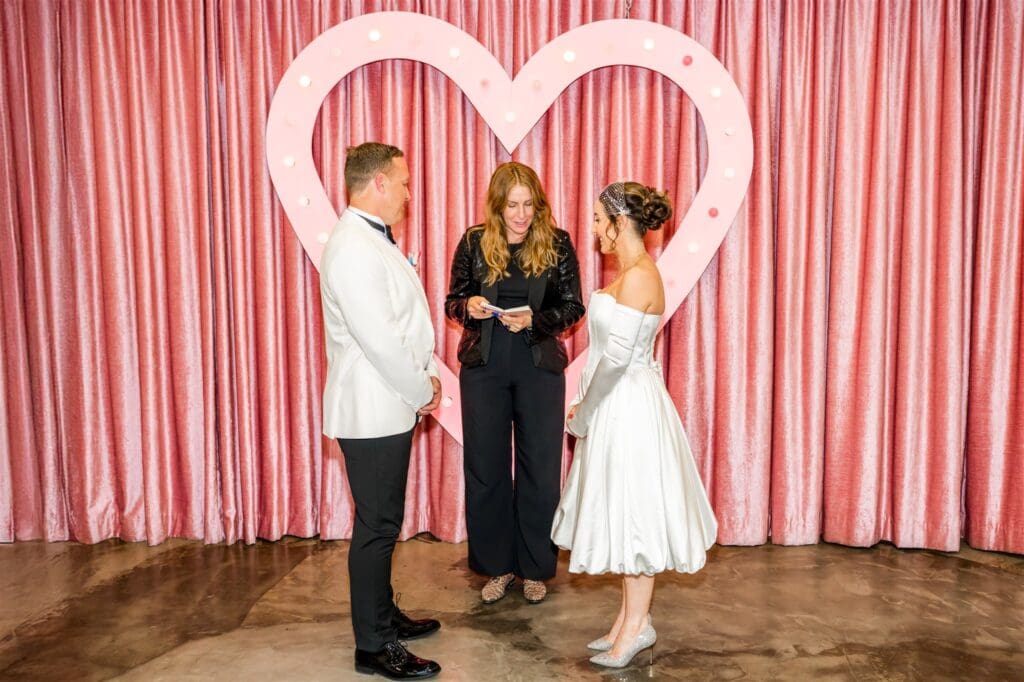 bride and groom holding hands during their elopement ceremony