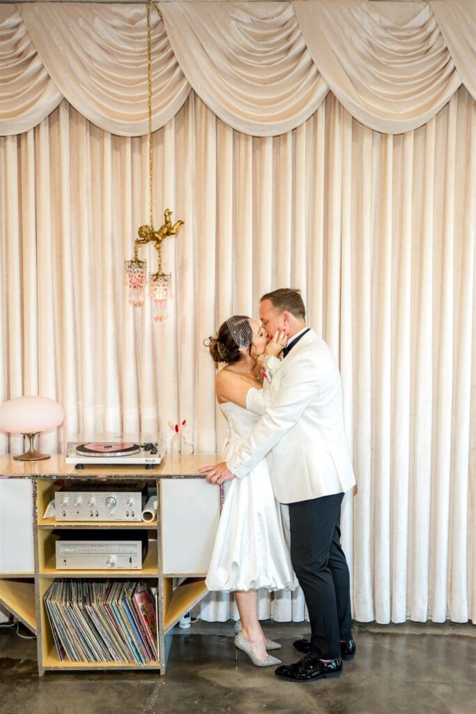 cute portrait of the newlyweds kissing