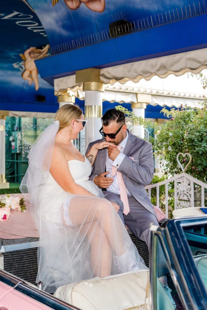 groom kissing the brides hand
