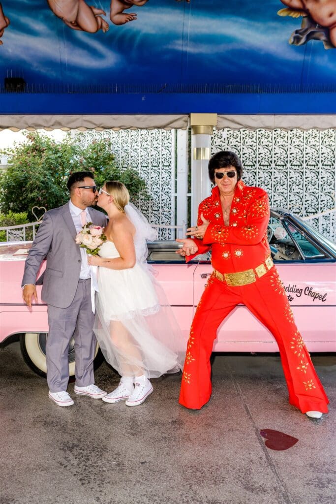 fun picture of the bride and groom with elvis