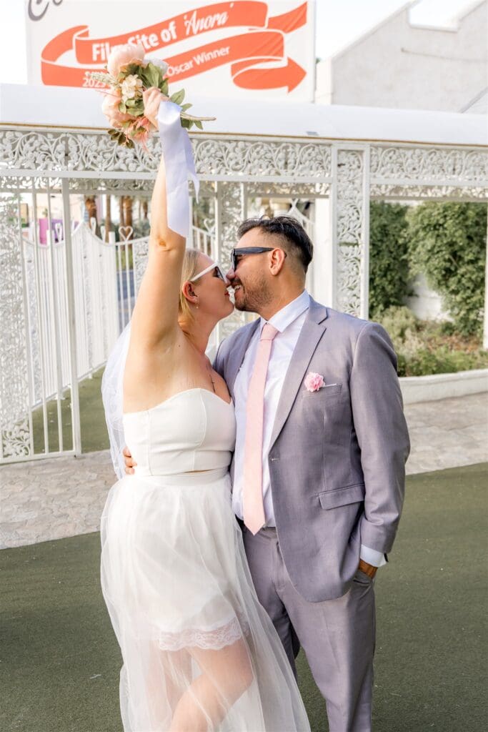 cute picture of the newly married couple kissing 